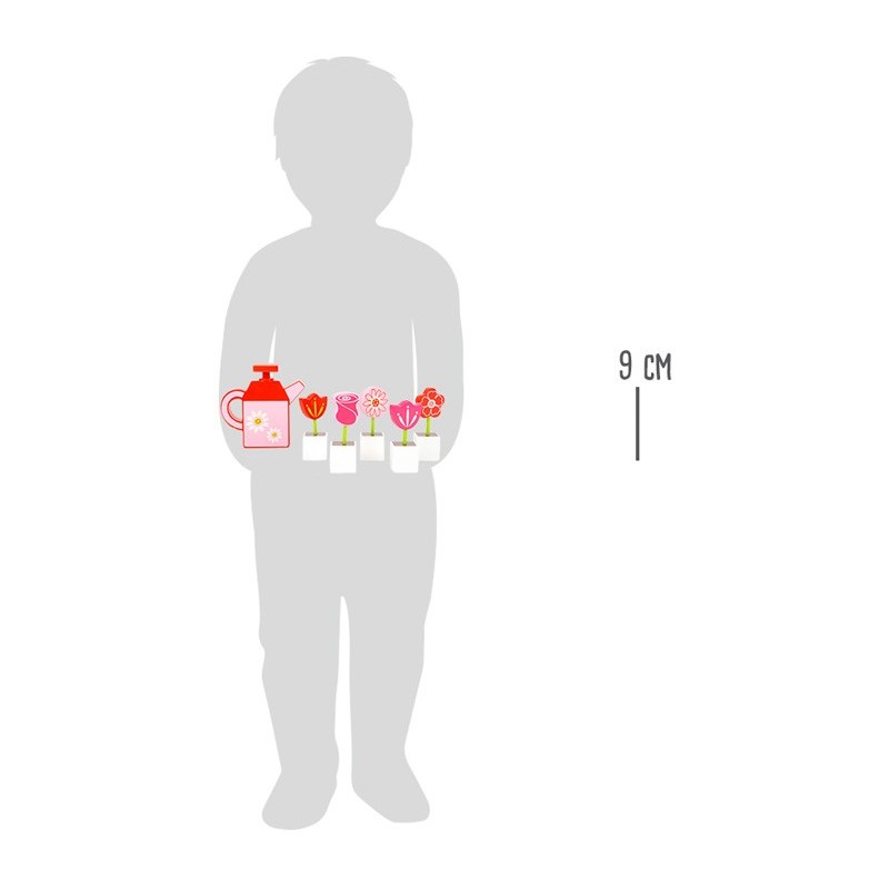 Fleurs et arrosoir en bois